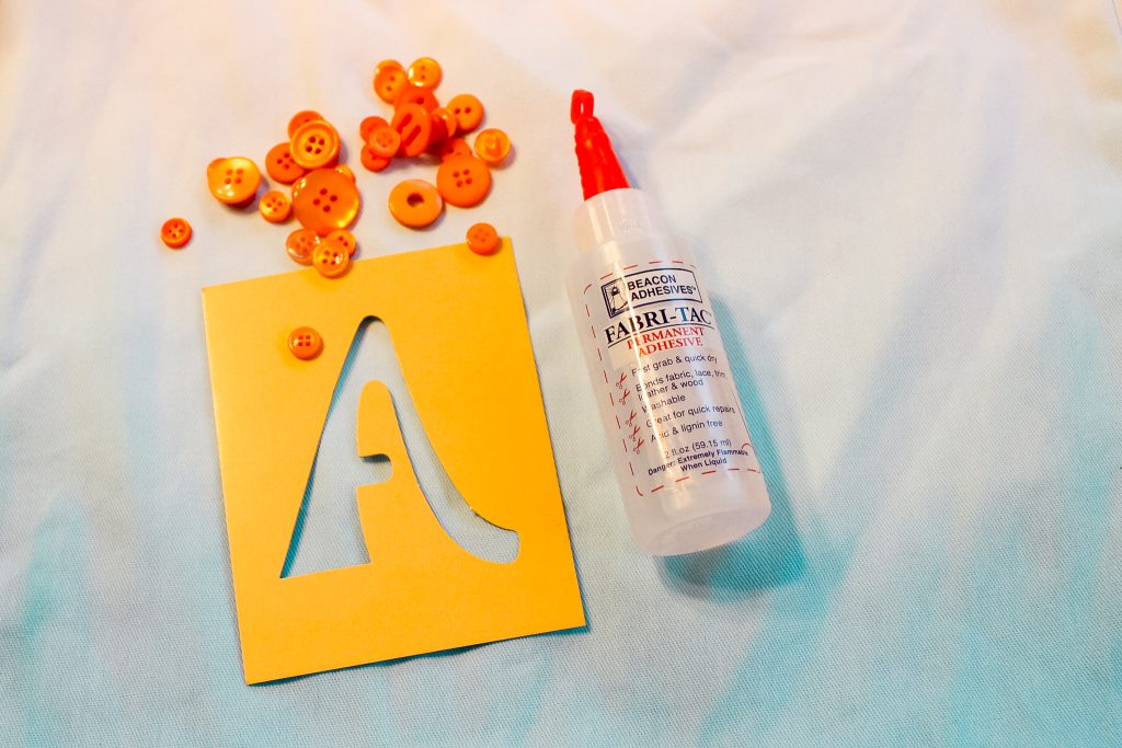 buttons and stencil with fabric adhesive