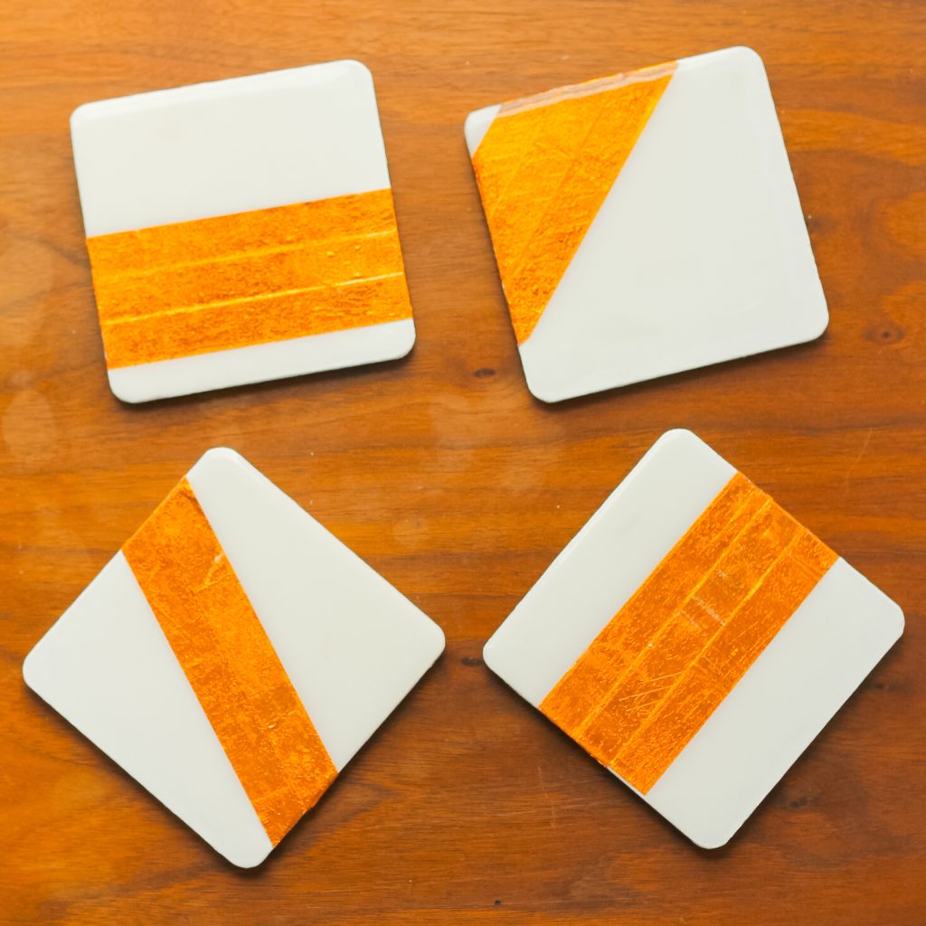 four different coaster with copper foil