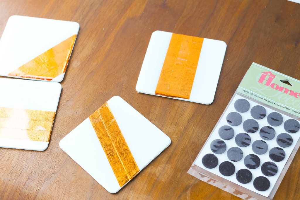 adding felt pieces to the bottom of coasters