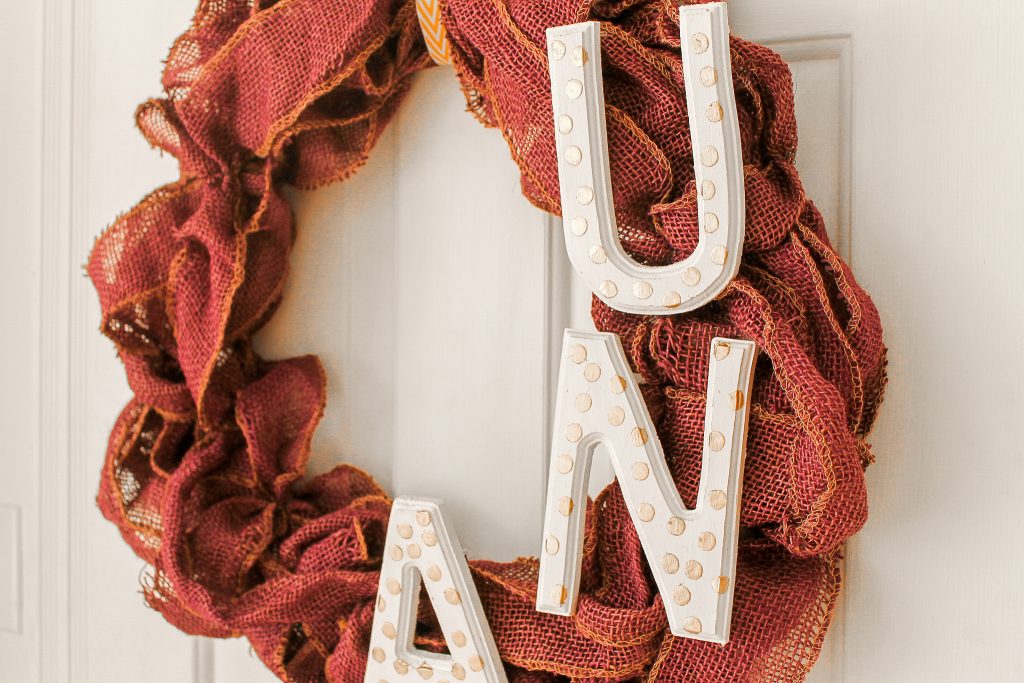 Painted letters on a burlap wreath