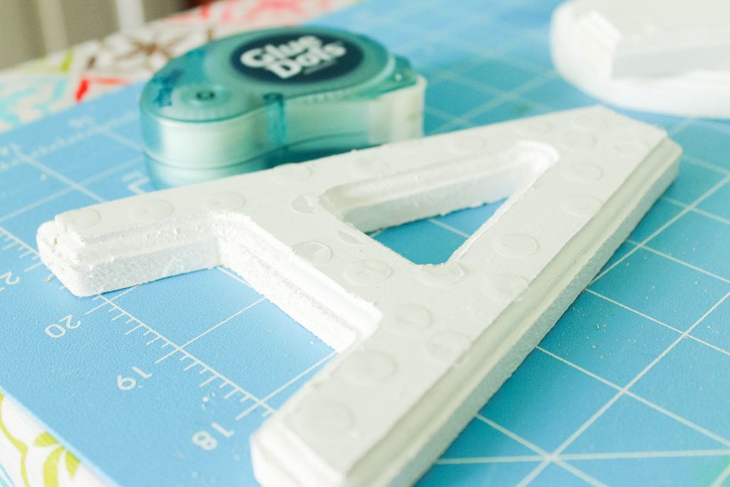 Adding glue dots to a painted letter