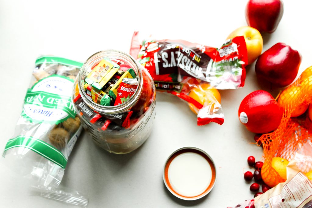 adding candy to the jar