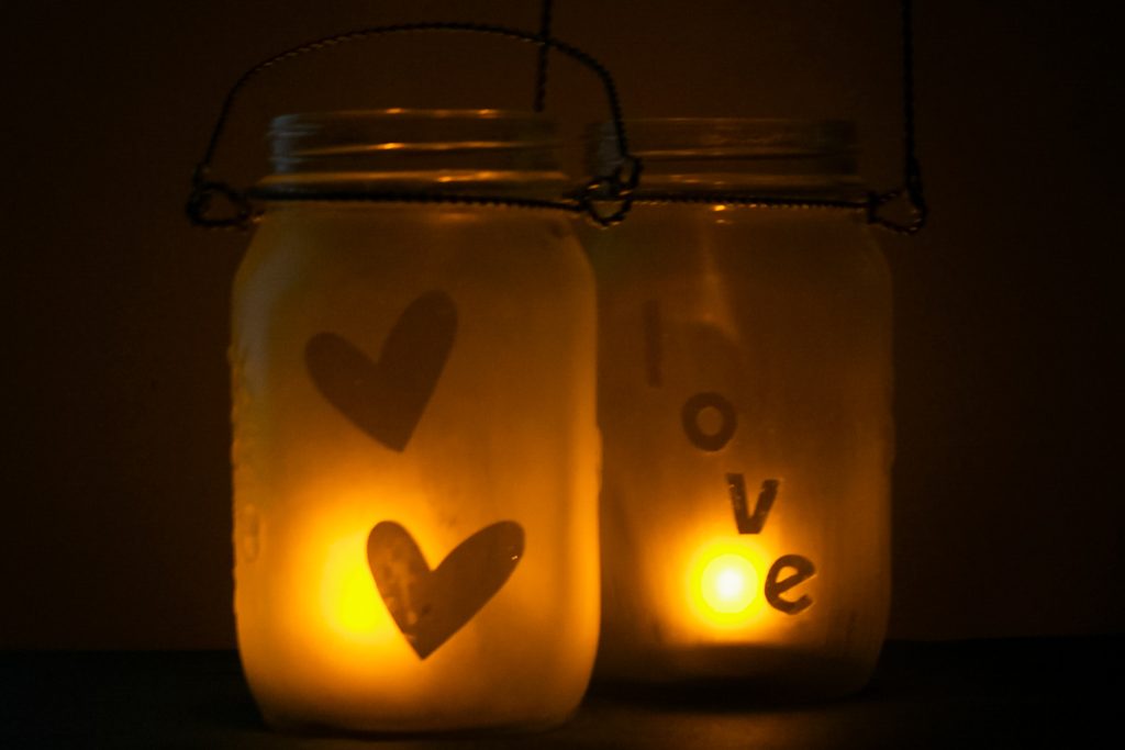 light shining through etched glass lanterns