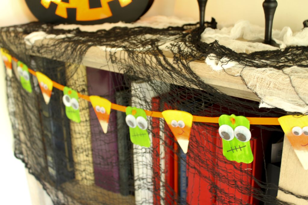 Cut halloween banner on a bookshelf