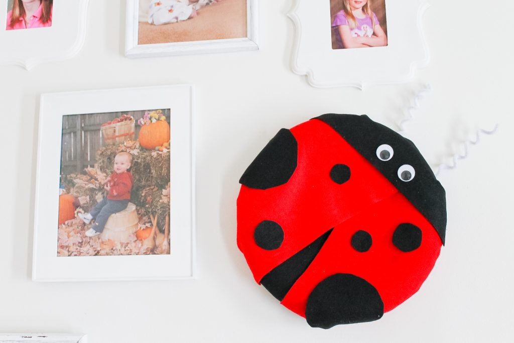 lady bug wreath hanging on a wall