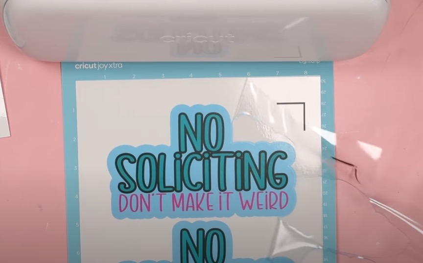 Remove window cling from around the design.
