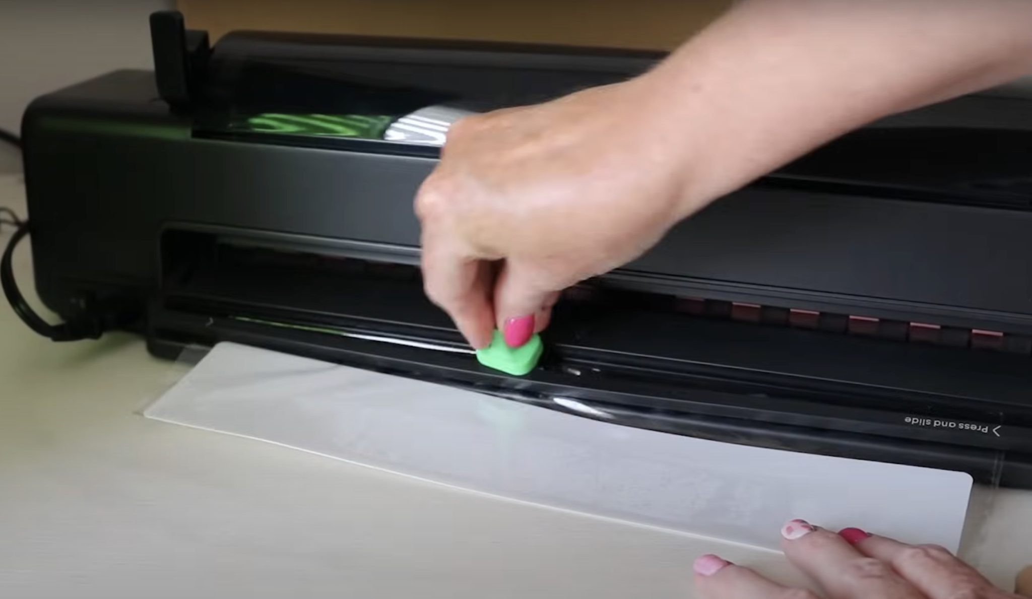 Trimmer on the back of the laminating module.