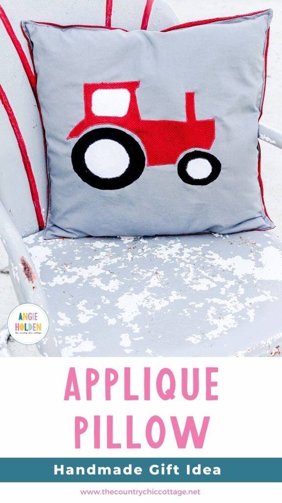Applique pillow with a red tractor