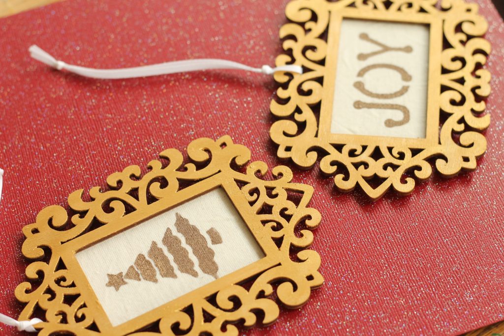 Stenciled fabric in frame ornaments
