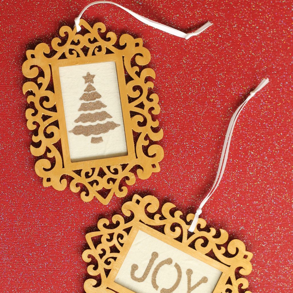 Wood frames with gold accents and stenciled fabric ornaments