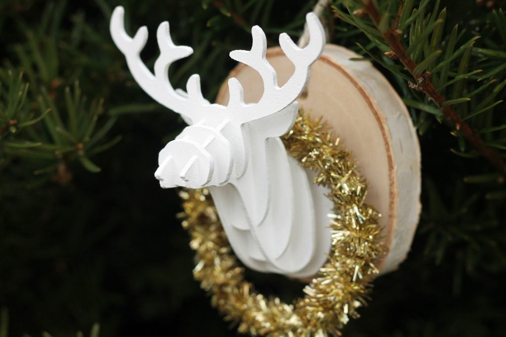 wooden deer head attached to a wood slice