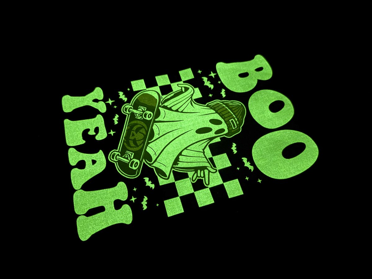 Skateboarding ghost glowing in the dark.