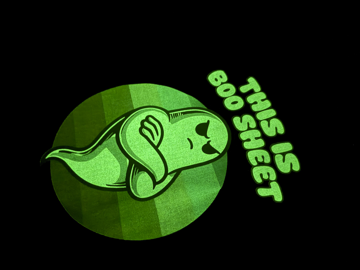 Boo sheet ghost glowing in the dark.
