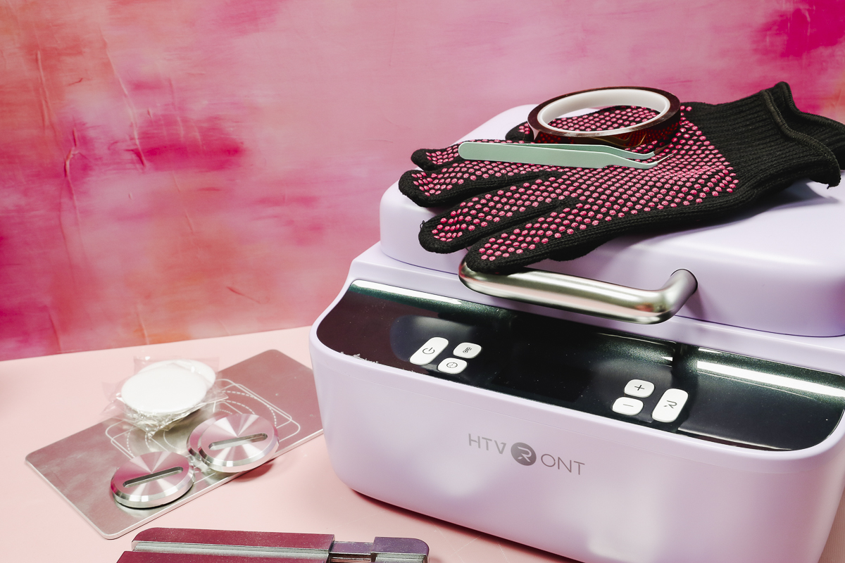 HTVRont phone case heat press and supplies.