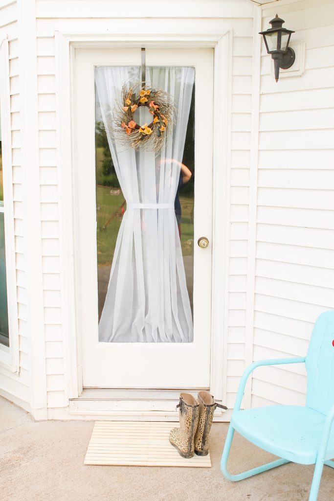 Pretty door with a wood doormat