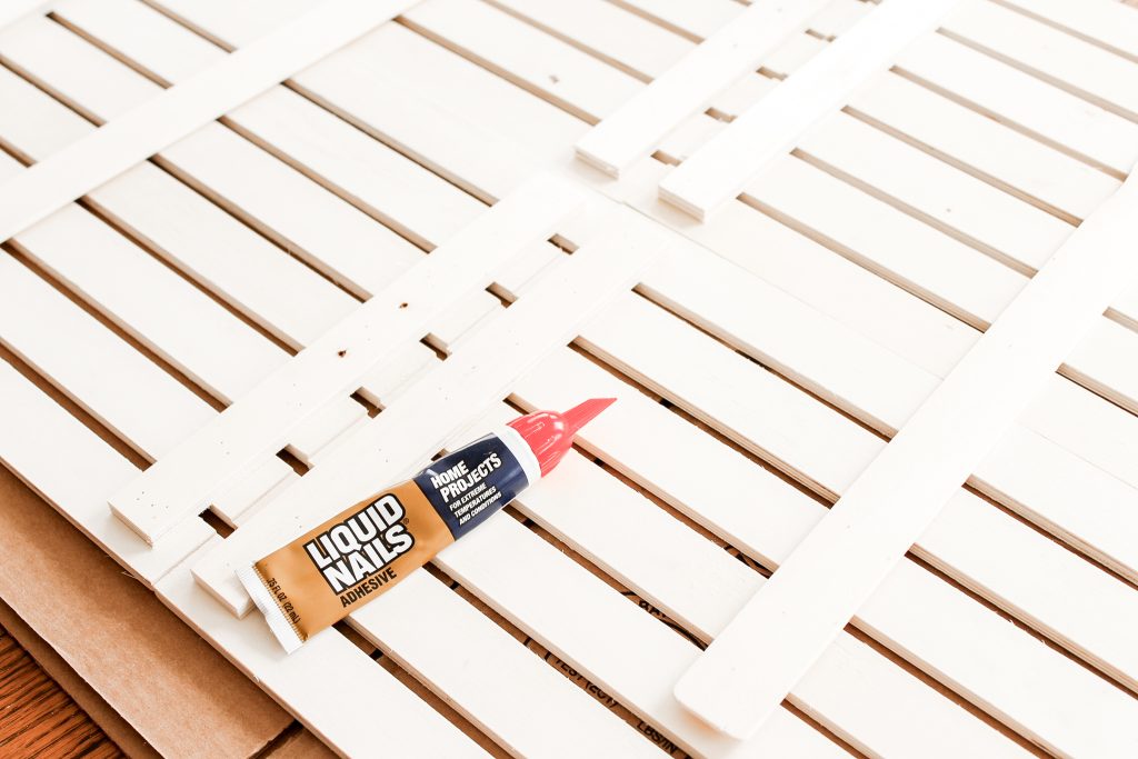 Liquid nails on a wood door mat