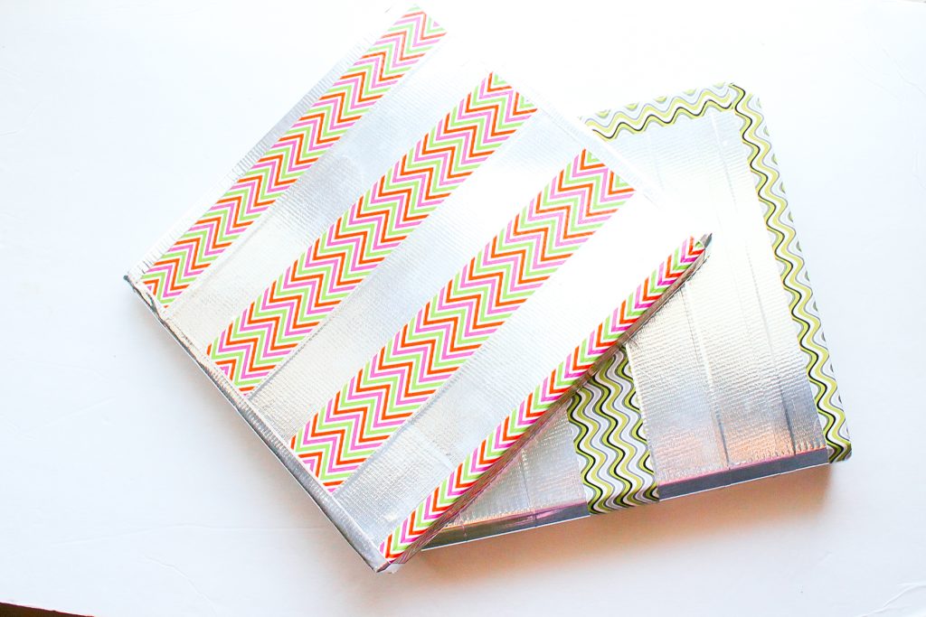 duct tape covered 3-ring binders