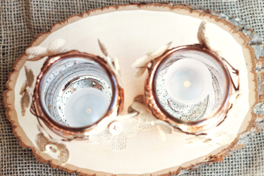 Tea lights placed inside copper jars