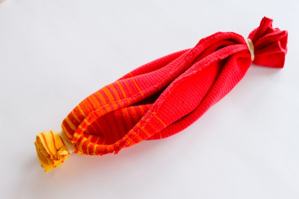 roll of fabric with rubber bands