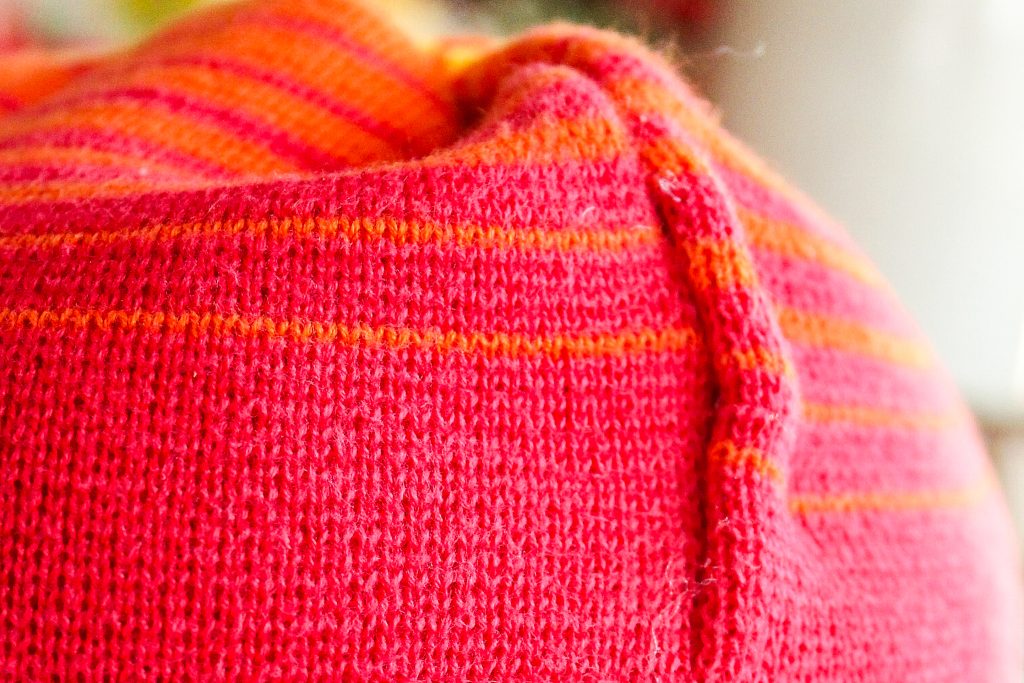 red fabric around stuffing