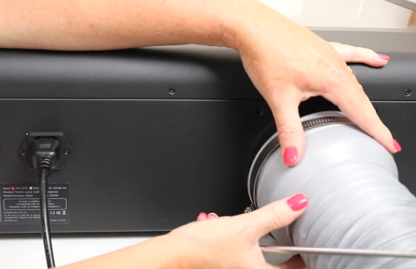 Attach hose to the back of the laser.