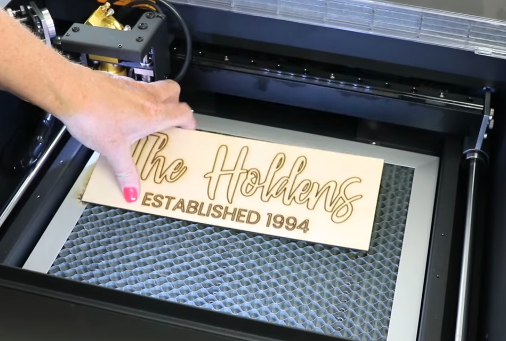 Remove finished project from laser bed.