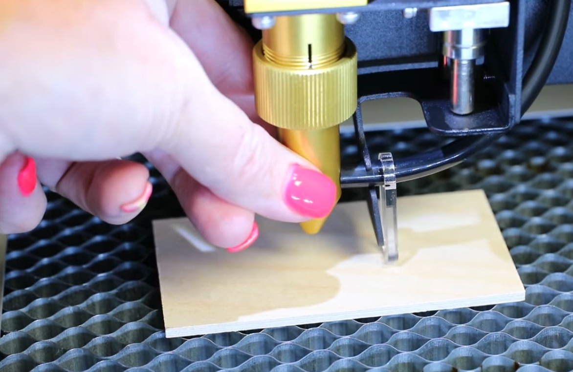 Manually focus the laser head.