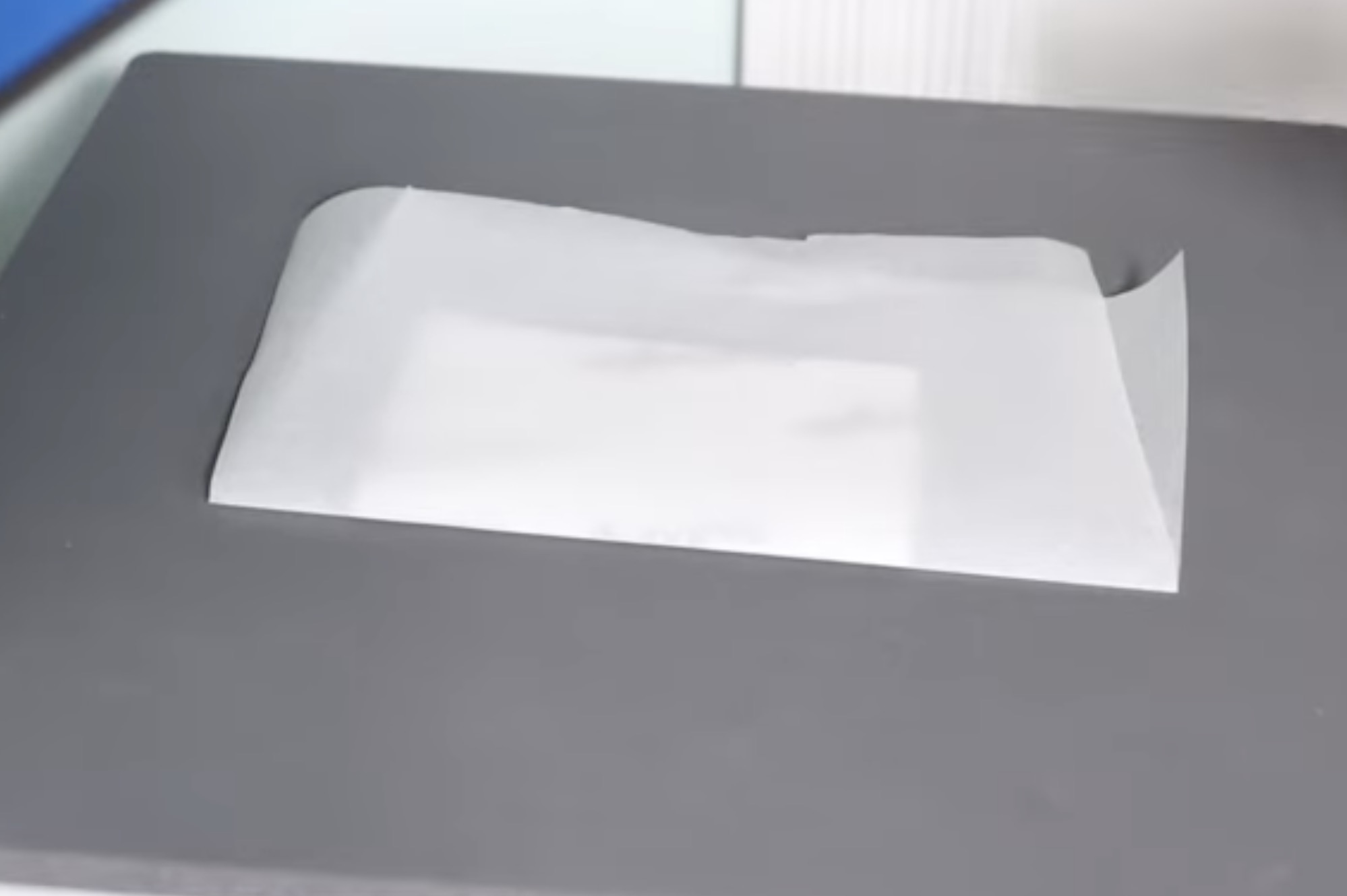 Place acrylic bookmark in heat press.