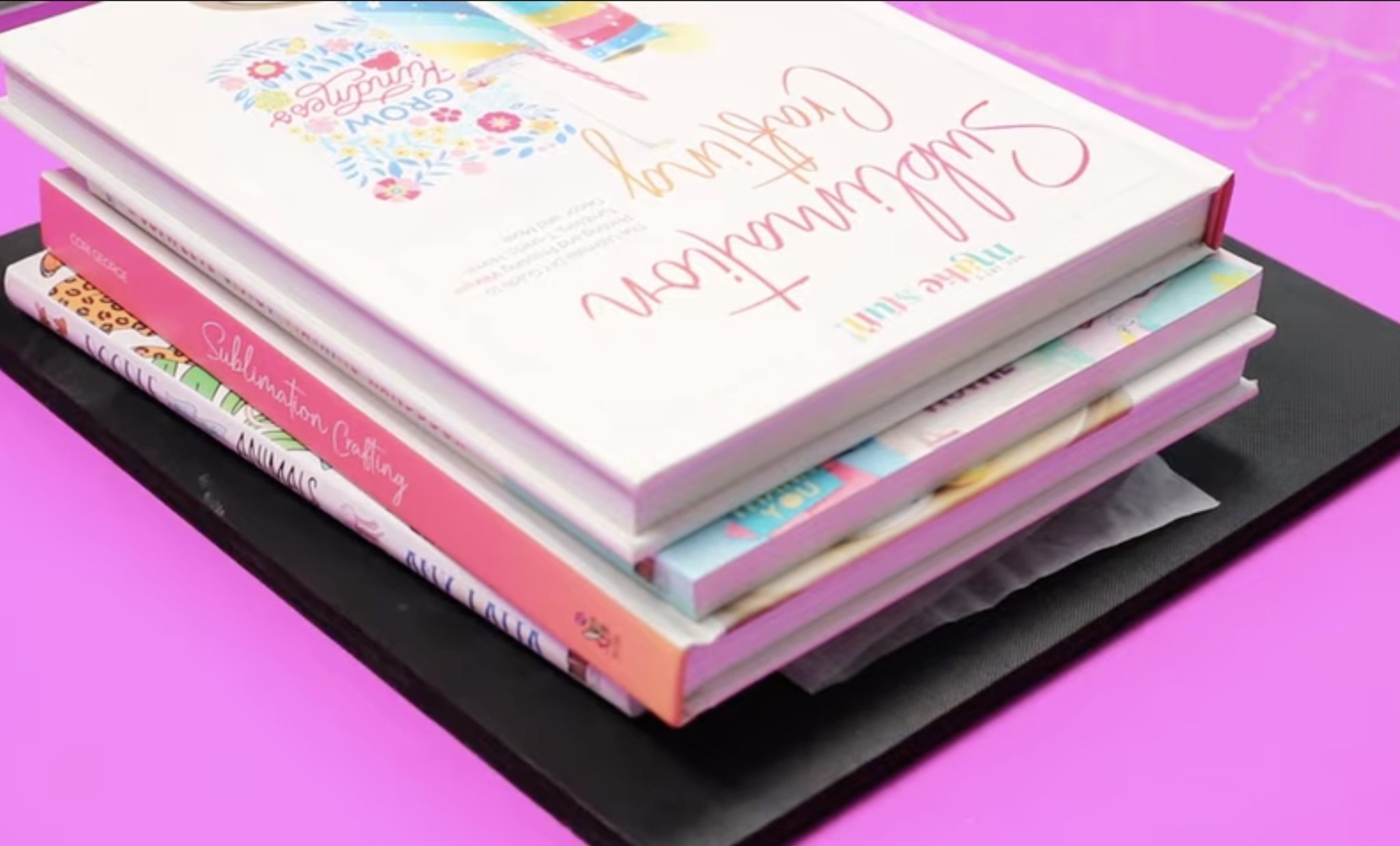 Place books on top of sublimation acrylic bookmark while it cools.