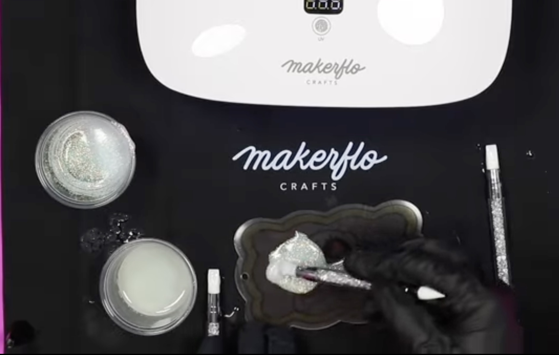 Add glitter UV resin to the back of the acrylic bookmark.