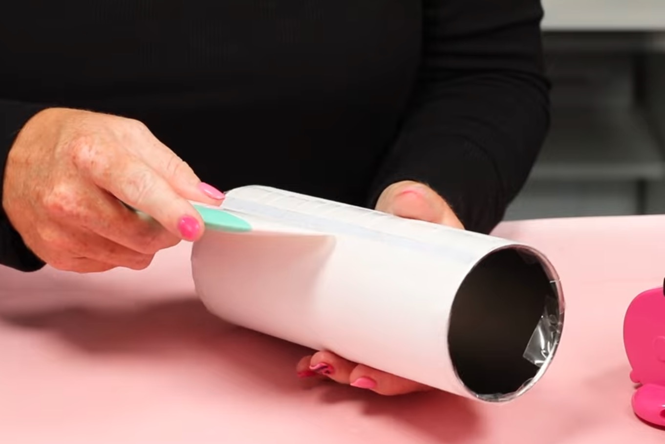 Use scraper to press down the tape.