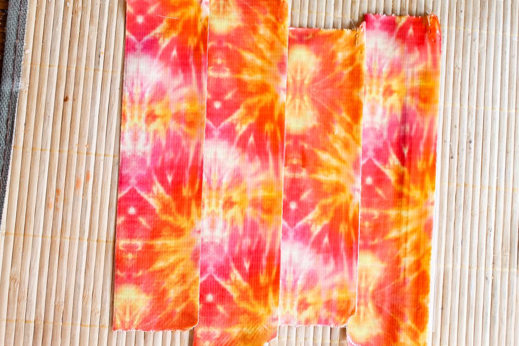 Strips of duck tape laying on a mat