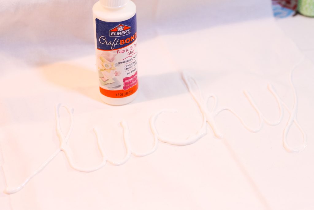 Lucky spelled with craft glue