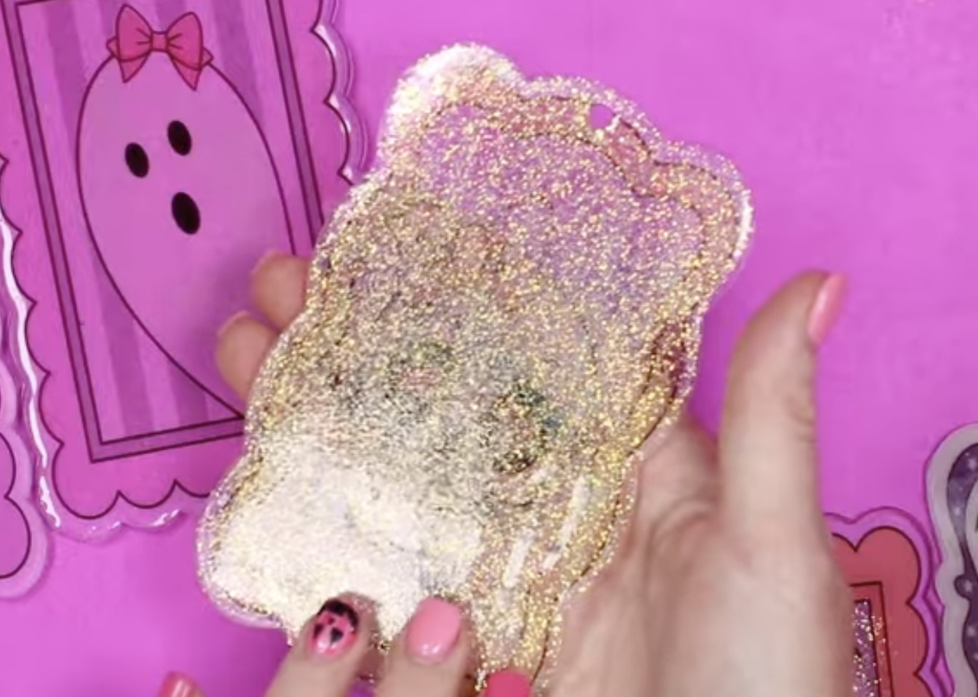 Clear UV resin with white glitter applied to the back.