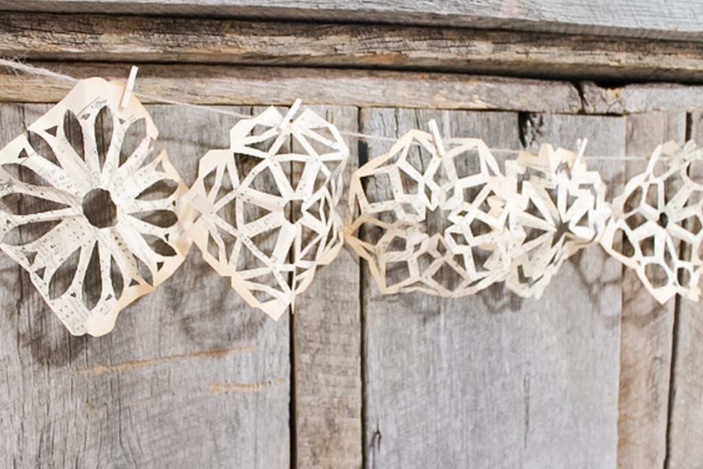 Snowflakes cut from sheet music