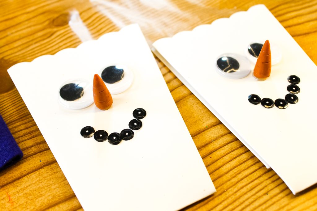 Glued snowman face on a popcorn box