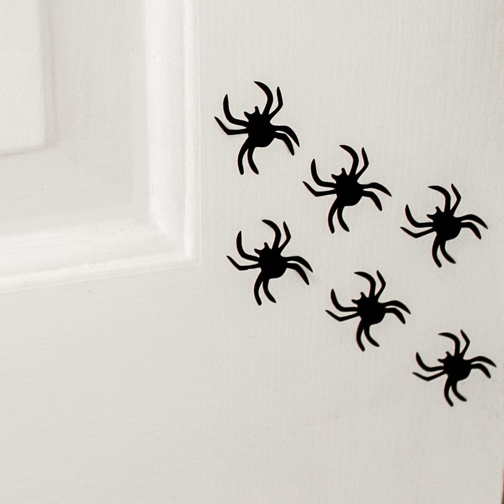 Vinyl spiders on a white door