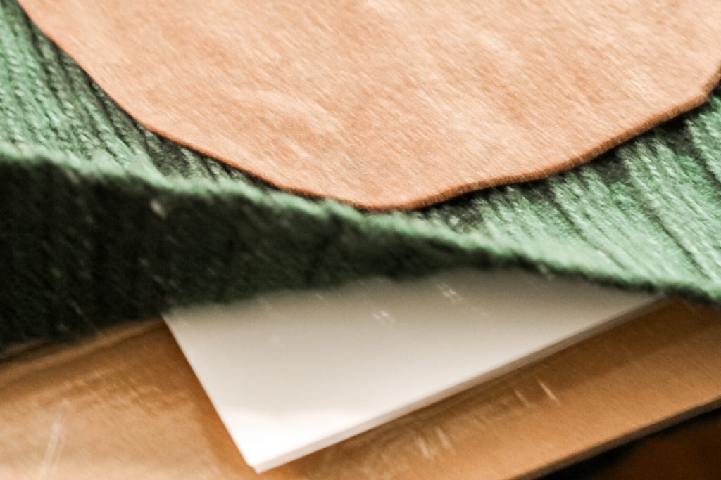 making sure the glue doesn't leak through to the back of the sweater