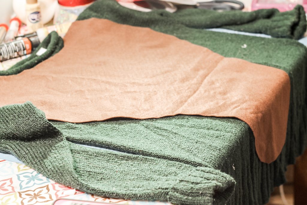 Cutting collar out of brown felt