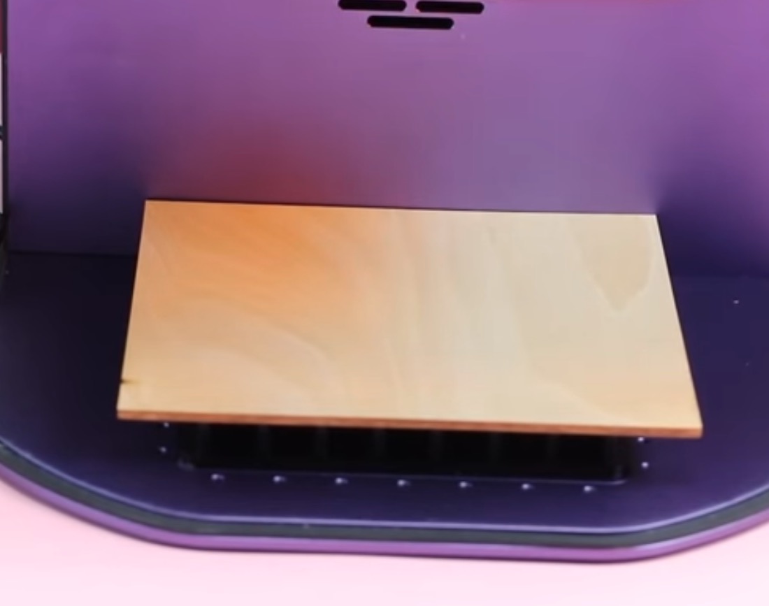 WeCreat Lumos with cutting bed and wood blank added.