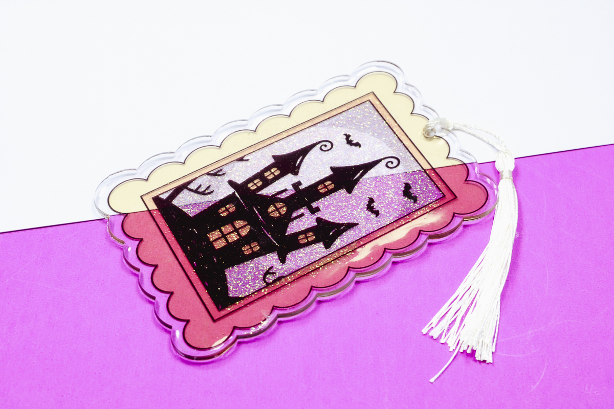 Clear acrylic sublimation bookmark with glow-in-the-dark resin.