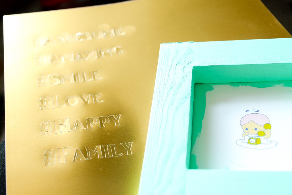 cut gold vinyl and painted frame