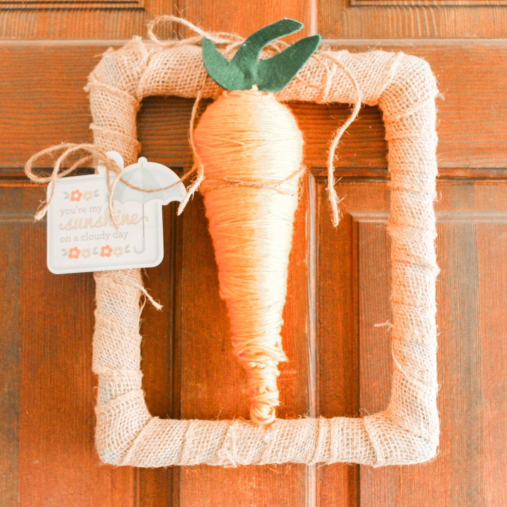 Carrot Spring Wreath -- grab some StyroFoam to make a fun carrot then add to a rectangular wreath. A fun spring wreath that is cute and unique. Carrot wreath to celebrate spring