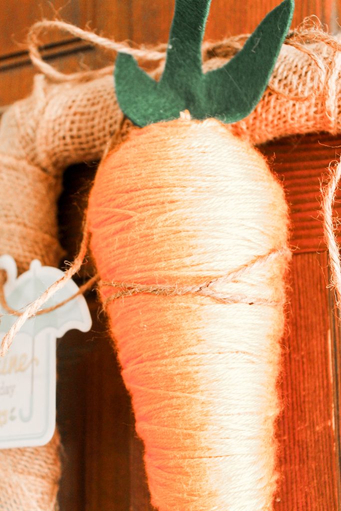 Carrot Spring Wreath -- grab some StyroFoam to make a fun carrot then add to a rectangular wreath. A fun spring wreath that is cute and unique.