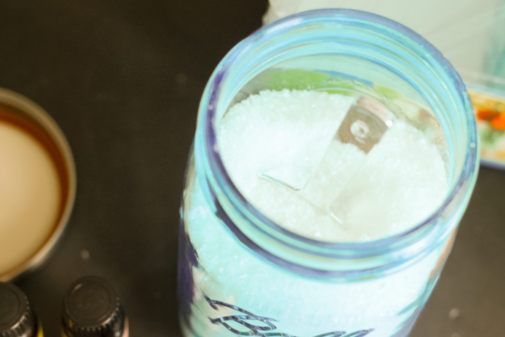 cute scoop added to jar of epsom salts