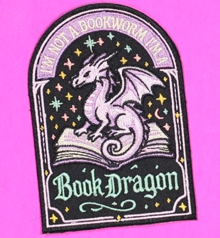 Large full embroidered patch with book dragon.