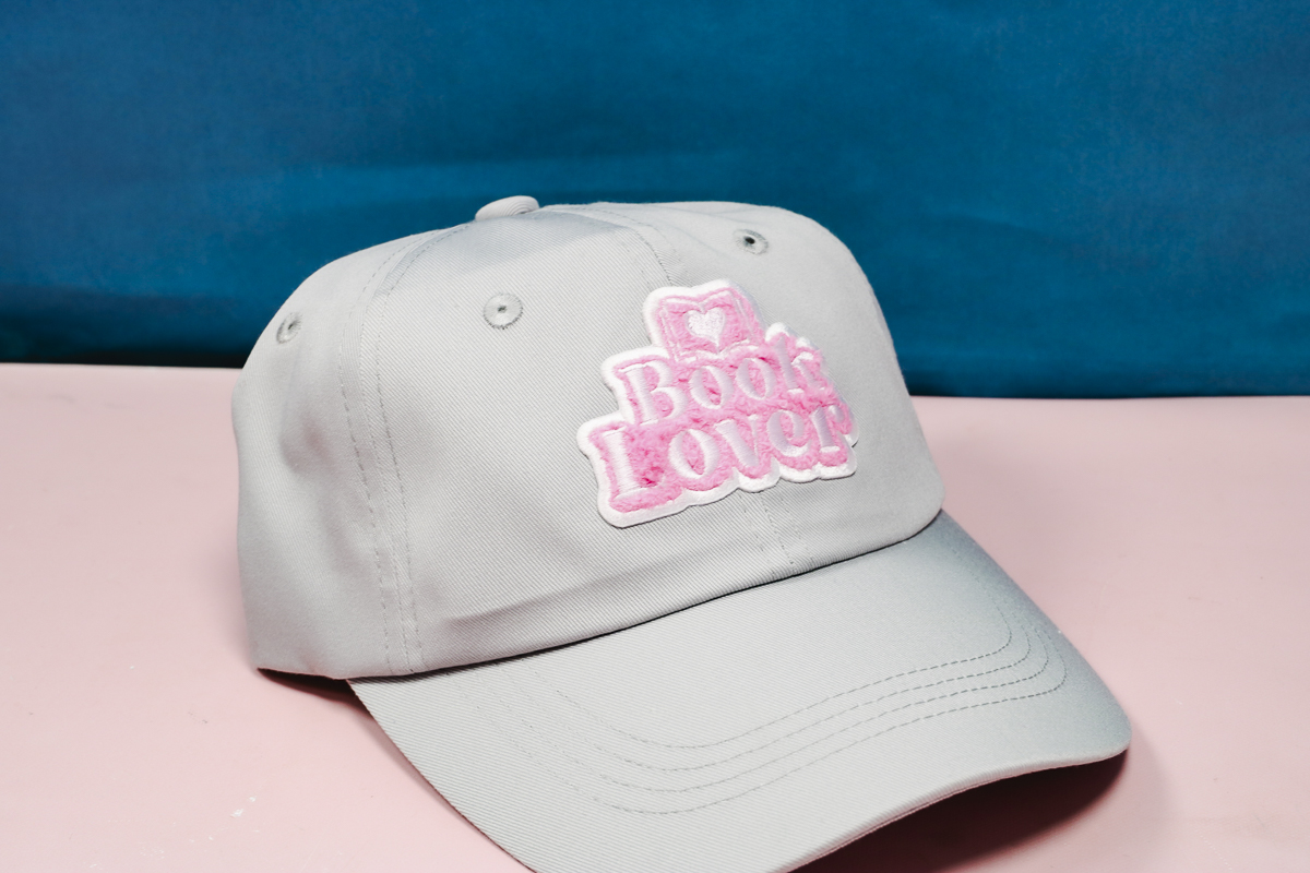 Finished hat with heat activated adhesive patch.