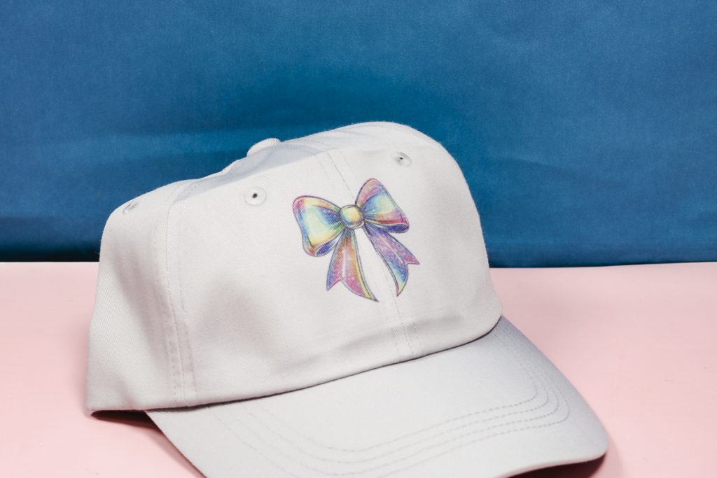 Finished HTVRont Auto Hat Press sublimation hat example.