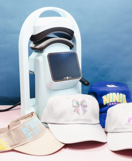 HTVRont auto hat press with finished hats.