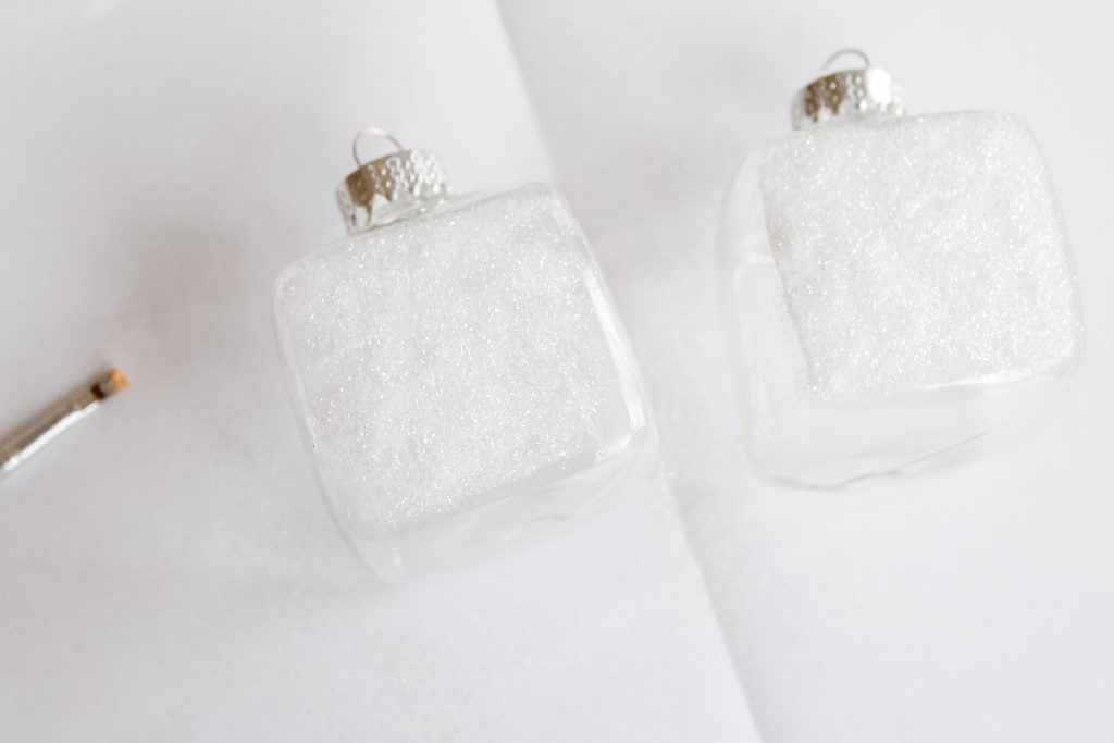 Kids Craft: Mini Snow Globe Ornaments -- click the picture to get the full instructions for making your own fun Christmas ornaments. adding decoupage and glitter to outside of glass ornaments